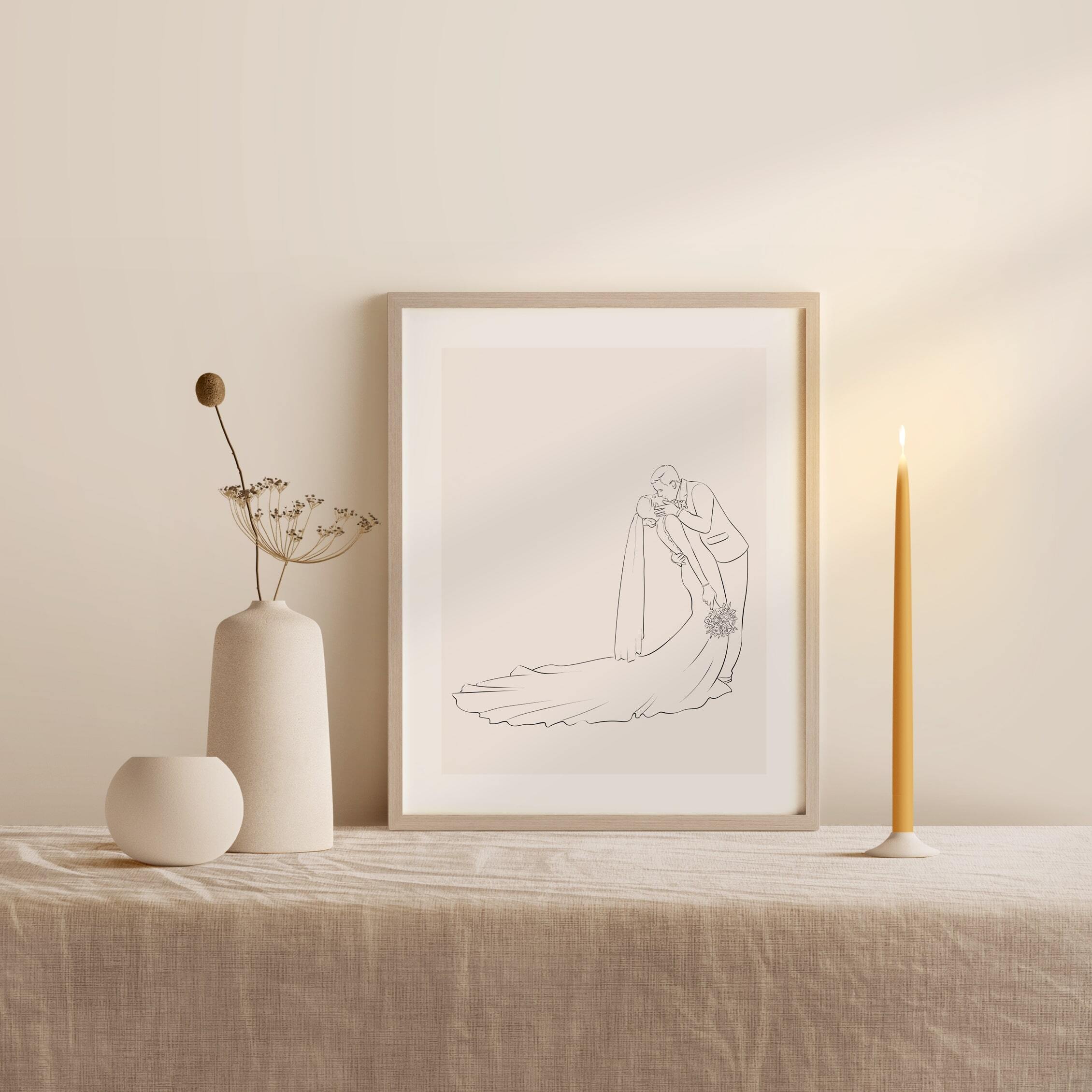 Bröllopsfoto av ett kyssande par i profil, illustrerat i Line Art-stil